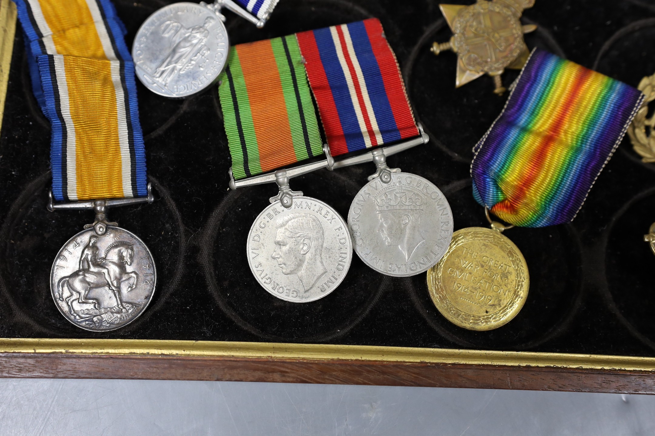 A WWI to Elizabeth II family medal group including WWI trio GSM with Borneo clasp, QEII Police medal etc